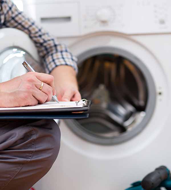 Technician Diagnosing a Dryer